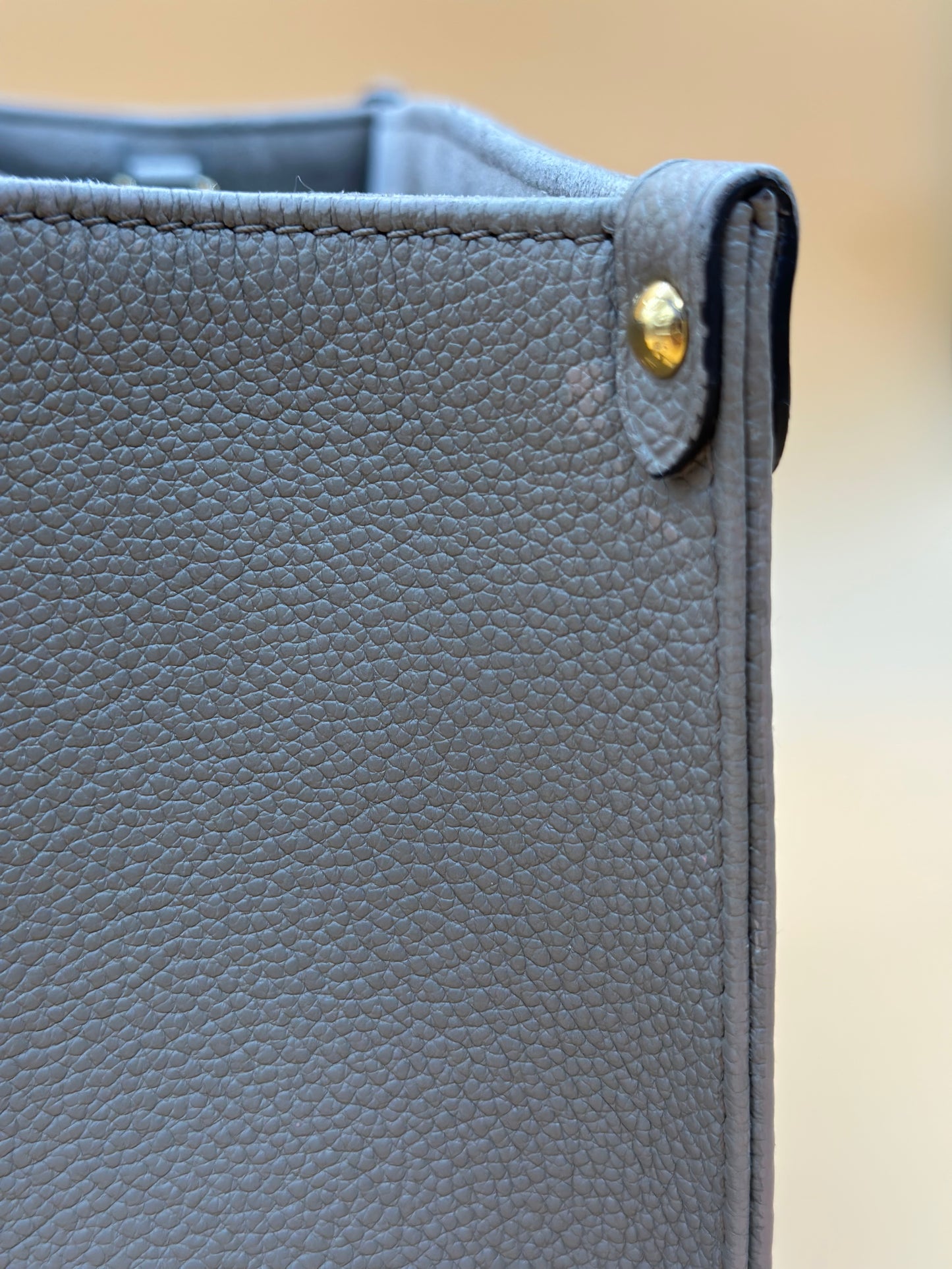 LV OTG BI-COLOR EMPREINTE PM