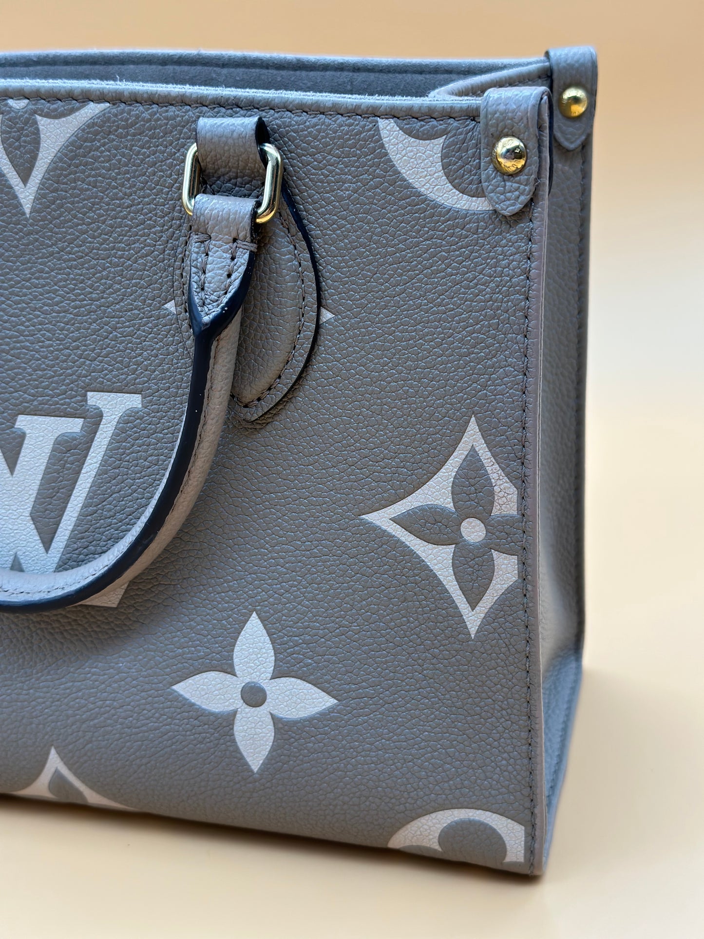 LV OTG BI-COLOR EMPREINTE PM