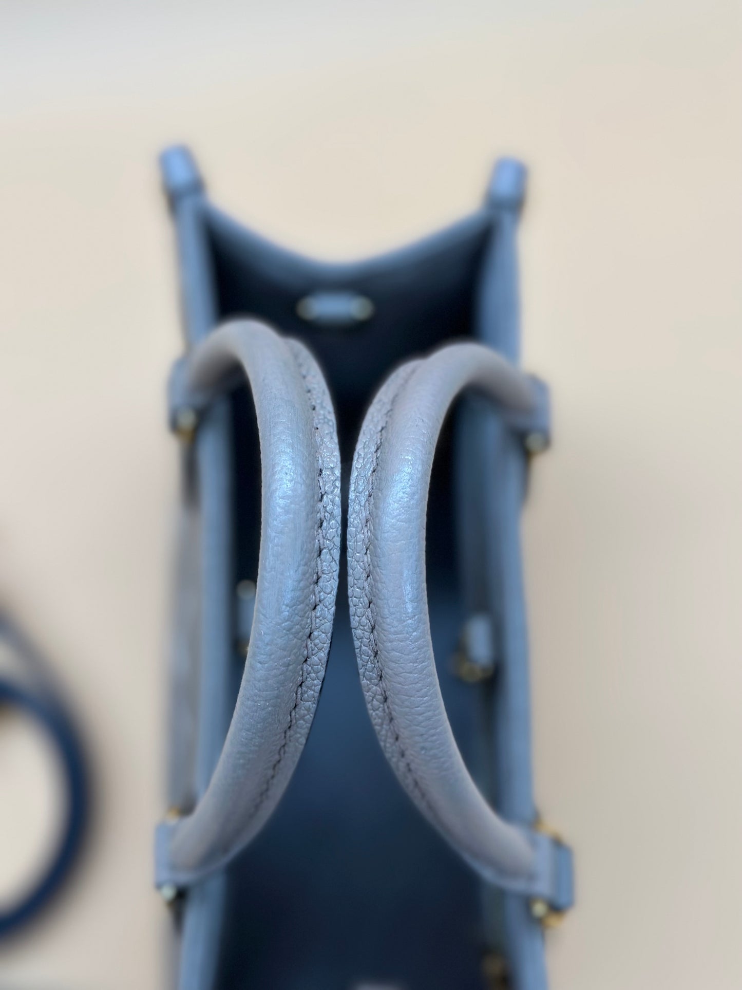 LV OTG BI-COLOR EMPREINTE PM