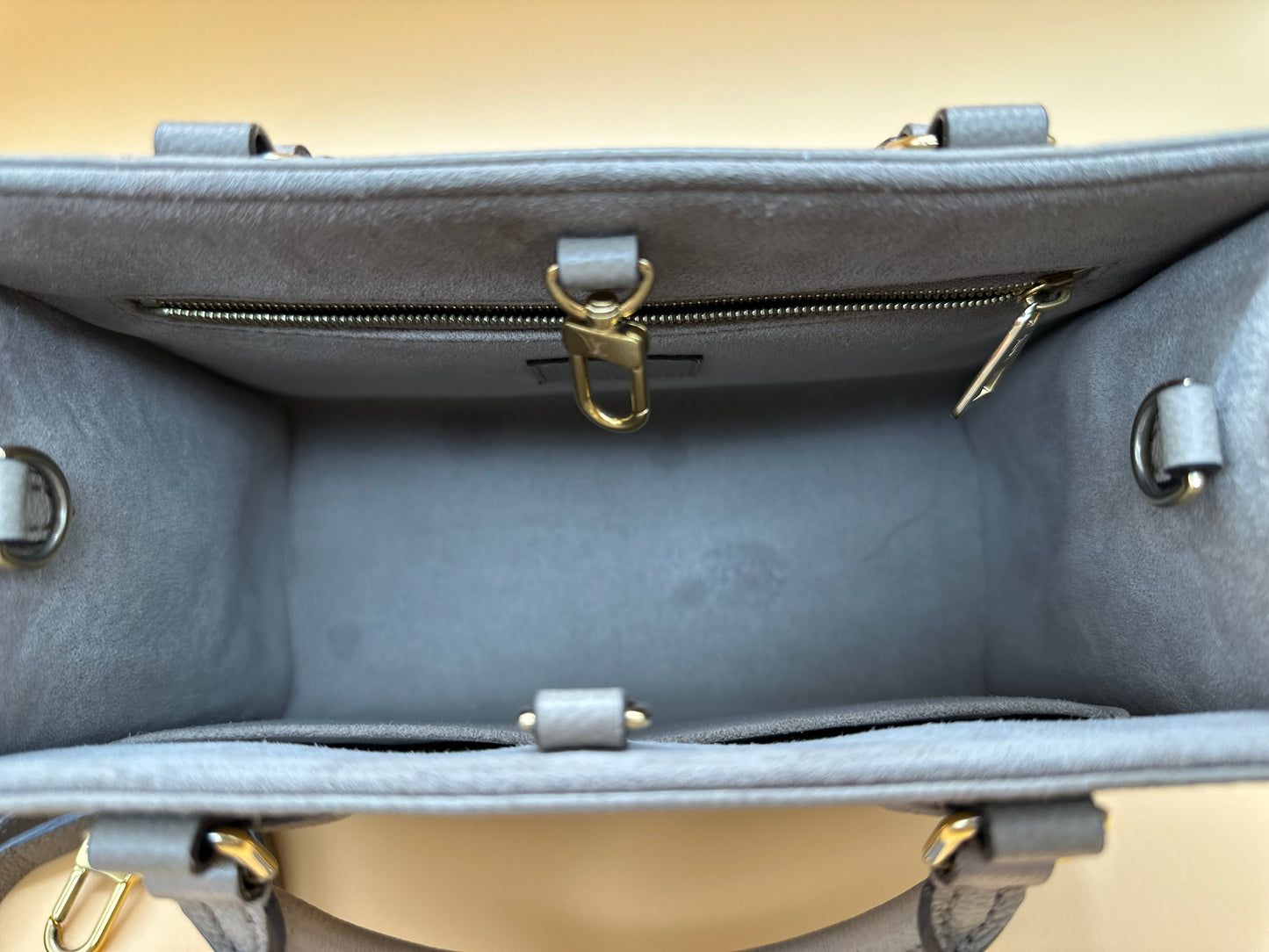 LV OTG BI-COLOR EMPREINTE PM