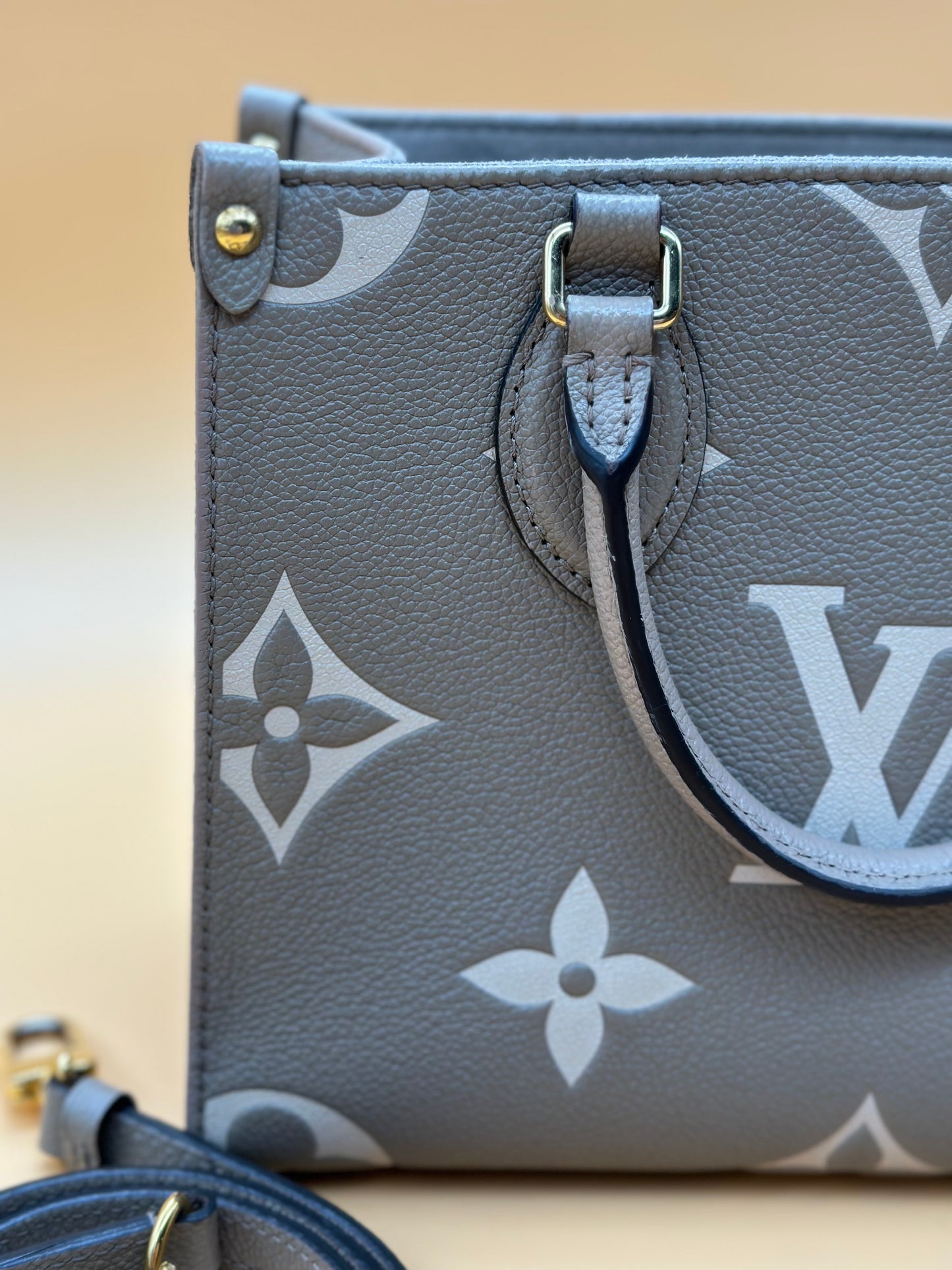 LV OTG BI-COLOR EMPREINTE PM